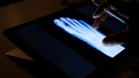 Doctor analyzing medical data on touchscreen computer Stock Footage 93622818