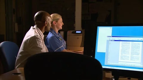 Doctor and nurse using computer Stock Footage 4852846