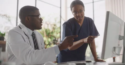Doctor and Nurse Using Computer | Stock Video | Pond5