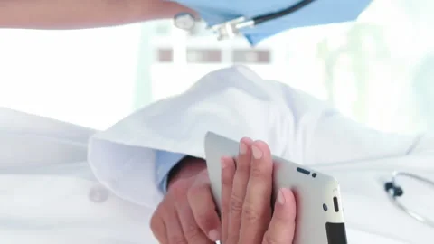 Doctor and nurse using tablet computer Stock Footage 302045652