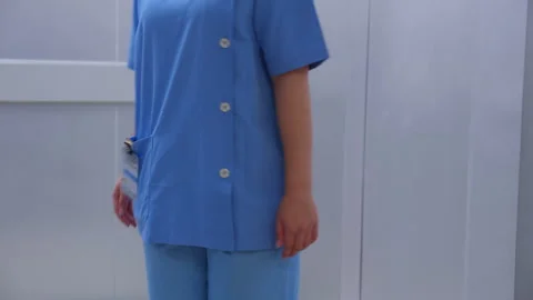 Doctor and nurse walking to elevator while young asian man leave elevator w.. Stock Footage 275189355