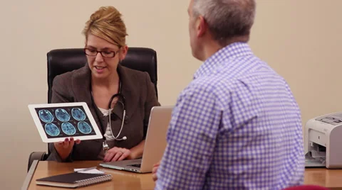 Doctor and patient looking at brain scans Stock Footage 35073700