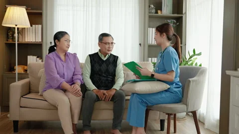 Doctor is asking about the illness of an elderly person in a nursing home. Stock-Footage 247412226