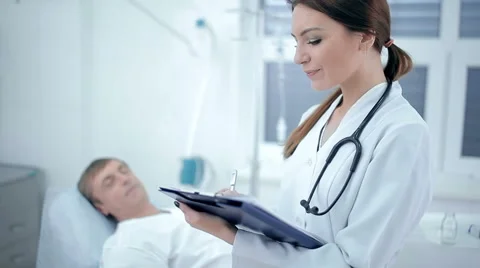 Doctor asking about the patient's state of health Stock Footage 60052288