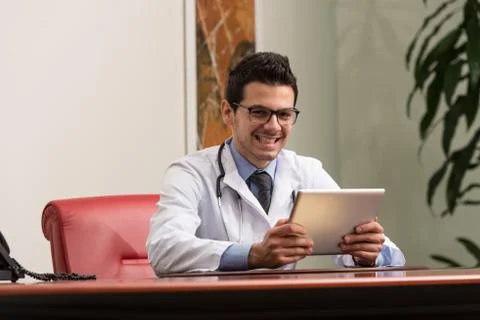 Doctor on a break with his computer Stock-Fotos