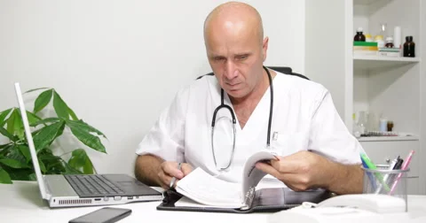 Doctor Cabinet Work Looking Schedule Browse Agenda Files Searching Patient Name Stock Footage 61449402