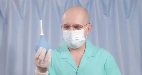 The doctor cannot make a choice between a large and a small enema. Видео 168280418