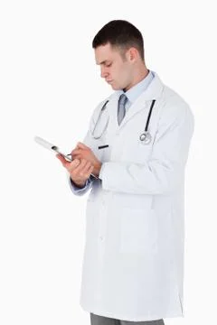 Doctor carefully taking notes Stock Photos
