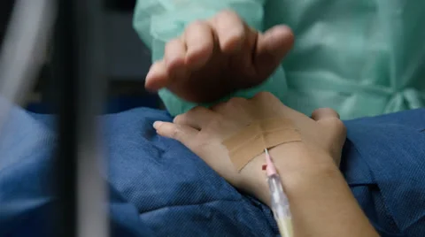 Doctor caresses patient's hand Stock Footage