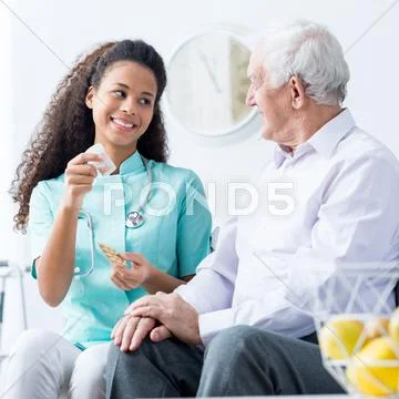 Doctor caring about elder person Stock Photos