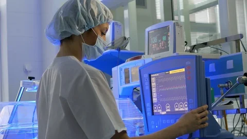 Doctor changes data on the monitor's Stock Footage 87861403