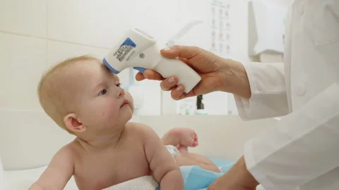 Doctor Checking Babys Temperature Stock Footage 312227918