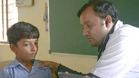 Doctor checking child indian Stock Footage 102758386