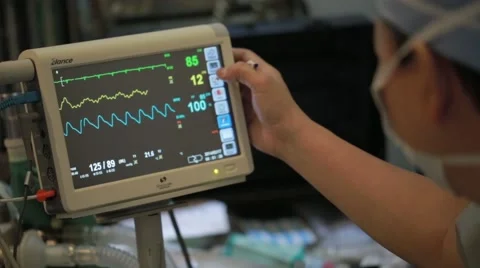 Doctor checking electro cardiograph machine Stock Footage 62388127