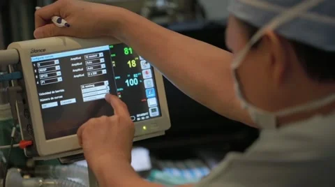 Doctor checking electro cardiograph machine Stock Footage 62388155
