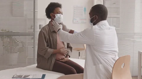 Doctor Checking Lymph Nodes on Neck of Pregnant Woman Stock Footage 169092264