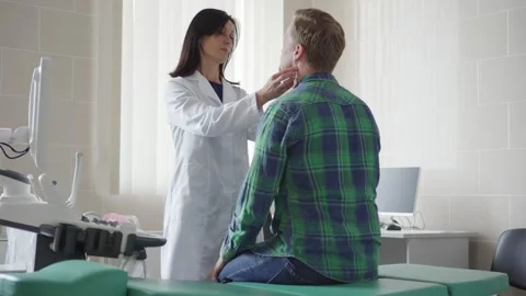 Doctor checking lymph nodes of patient Stock Footage 142662875