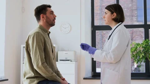 Doctor checking lymph nodes of patient at hospital Stock Footage 197280081