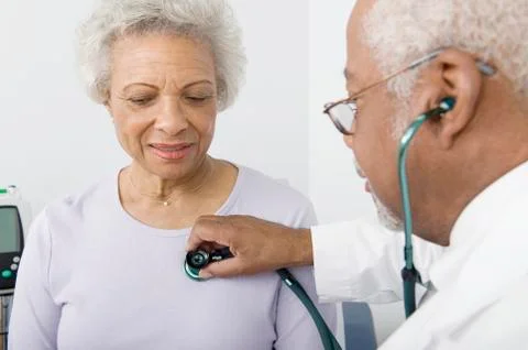 Doctor Checking Patient's Heartbeat Using Stethoscope Stock Photos
