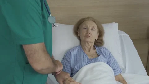Doctor checking patient's pulse rate Stock Footage 156683682