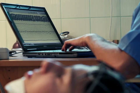 Doctor checking results of brain scan on laptop in hospital NTSC Stock Footage 44359194
