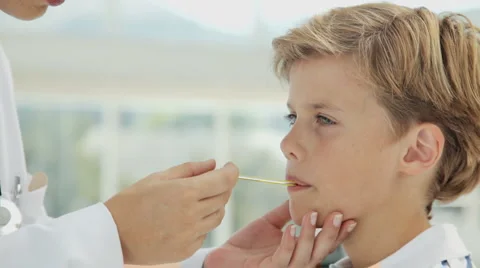 Doctor Checking the Temperature of a Boy Stock Footage 893818