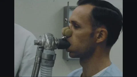 Doctor checks breathing function of returned POW serviceman - 1973 動画素材 99916840