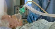 Doctor Checks Hospitalized Elderly Woman Who Is Attached To A Breathing Device Stock Footage