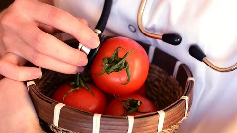 Doctor checks up a tomato concept of control of harvest quality Stock Footage 101843238