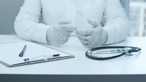 The doctor communicates with the patient.  Stock Footage 248307128