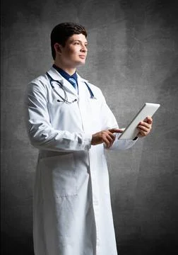 Doctor with a computer tablet Stock Photos