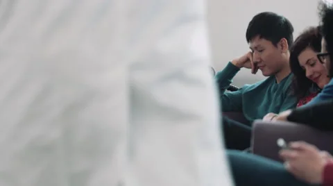 Doctor consulting patient in hospital waiting room Stock Footage