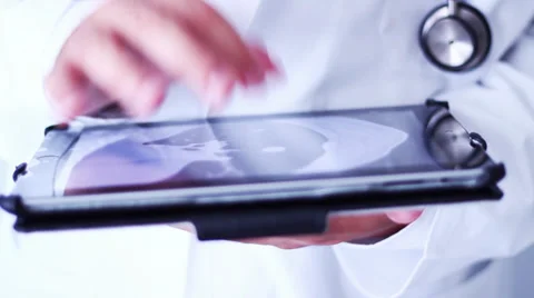 DOCTOR CONTROLLING X-RAY Stock Footage 28188352