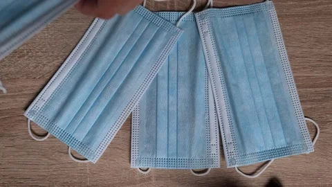  Doctor Counting And Checking Pack Of Surgical Masks One By One Stock Footage 156104603