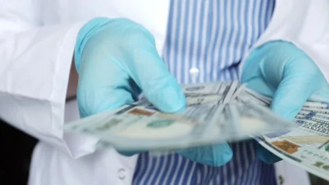 doctor counts cash money dollars, corrup... | Stock Video | Pond5