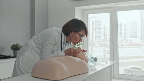 Doctor Demonstrating CPR Process To Students Stock Footage 223926597
