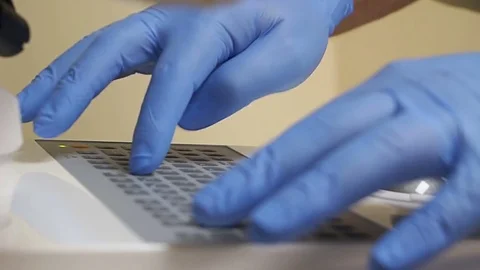 Doctor dentist working with high technology machine in dental clinic Stock Footage 71725631