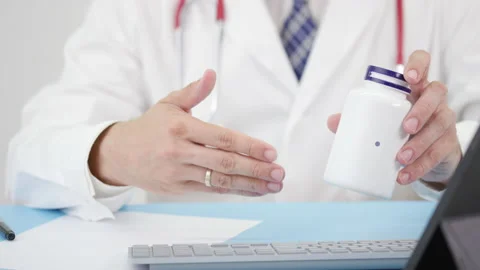 Doctor describing some a generic PROSTATE SUPPORT to a patient Stock Footage 137208348
