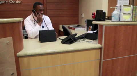 Doctor at desk Stock Footage 32883171