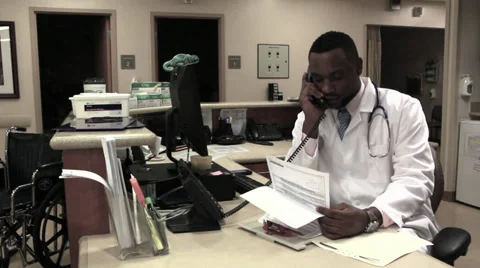 Doctor at desk Stock Footage 32885343