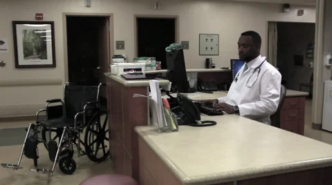 Doctor at desk Stock Footage 32885525