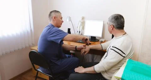 Doctor diagnoses the patient using a computer Stock Photos