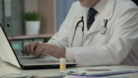 Doctor discussing with colleagues impact of new medications on medical forum Stock Footage