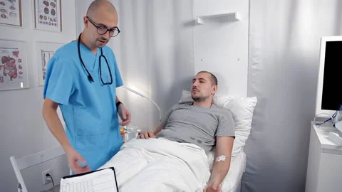 The doctor does not make hasty conclusions about the diagnosis of the patient Stock Footage 100044732