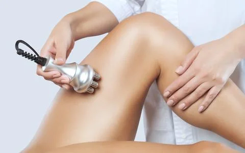 The doctor does the Rf lifting procedure on the legs, buttocks and hips of a  Stock Photos