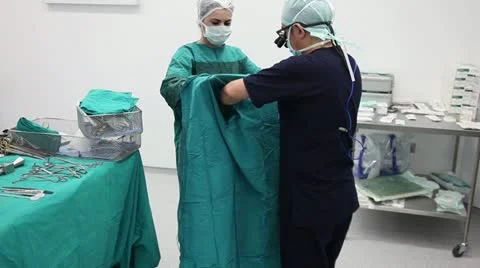 The doctor dressed for the surgery 2 HD 1080p Stock Footage 10895705