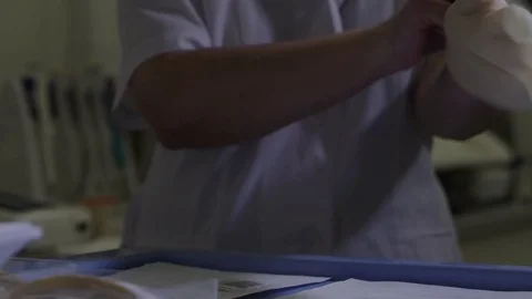 Doctor dresses gloves Stock Footage 76053053