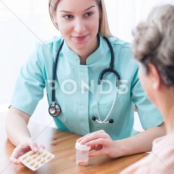 Doctor during home visit Stock Photos