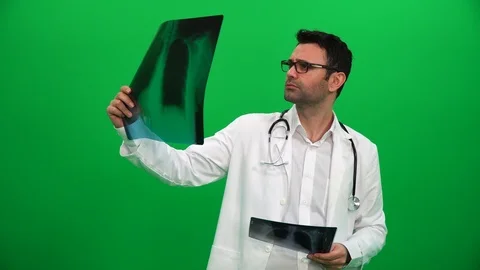 Doctor Examines Chest X-Ray On Green Screen Stock Footage 88652062