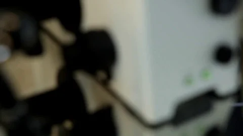 The doctor examines the sperm samples under a microscope. Stock Footage 76364626